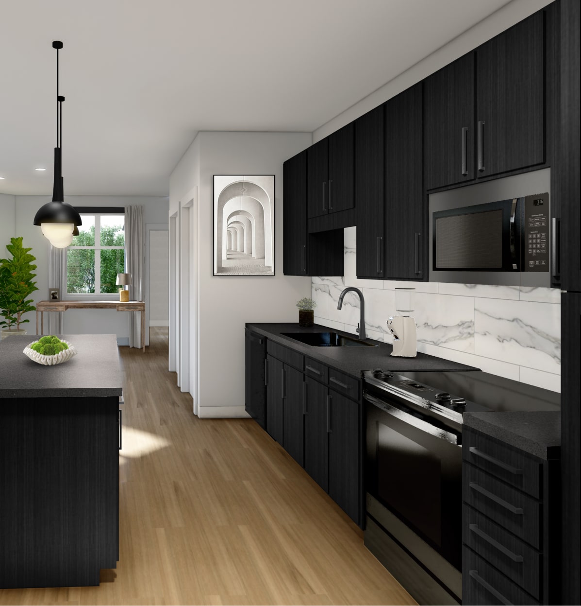 Open plan all black kitchen with a black kitchen island, wall art and minimal decor